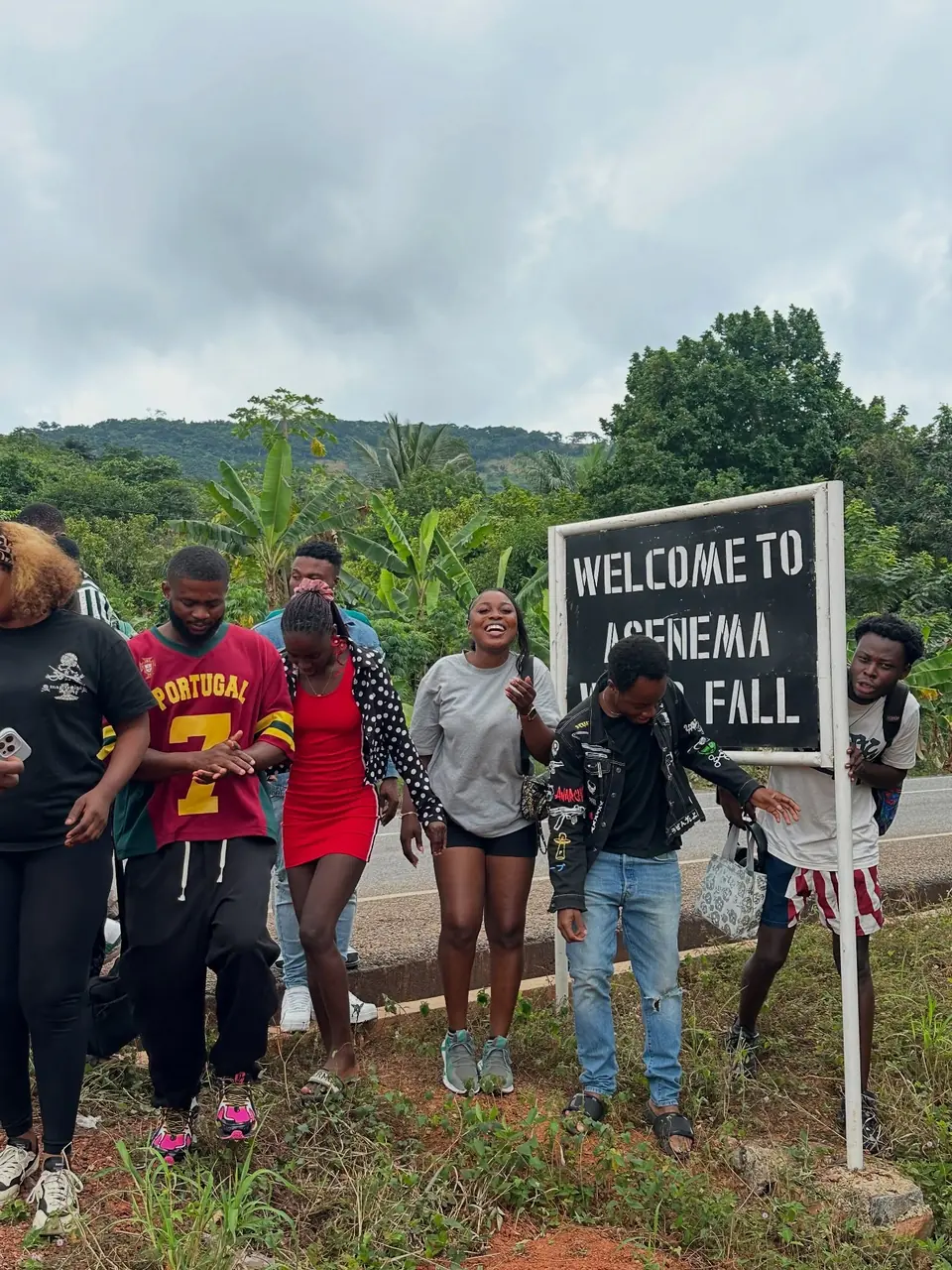 Travellers at Asenema Waterfalls.